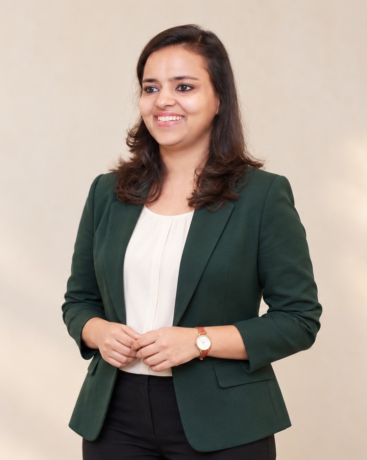 Ritika Agarwal smiling in a green blazer, ready to teach practical AI